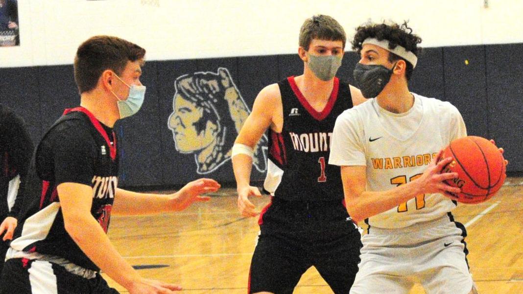 Partker holds ball while Alexander closes in